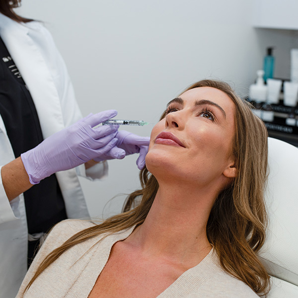 Woman receiving injectable treatment